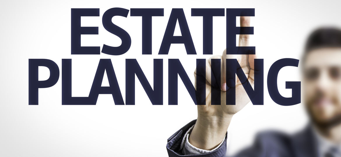 Business man pointing to transparent board with text: Estate Pla