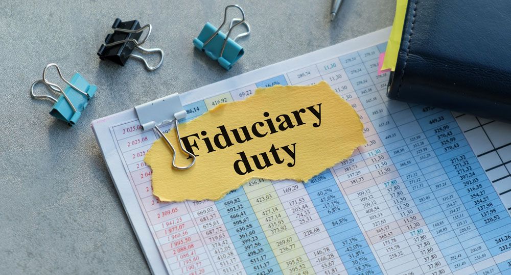 Documents and Clips with Fiduciary Duty written on paper clipped to files.